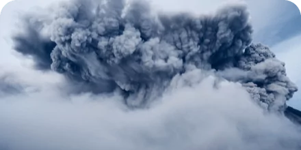 dark clouds surrounding volcano